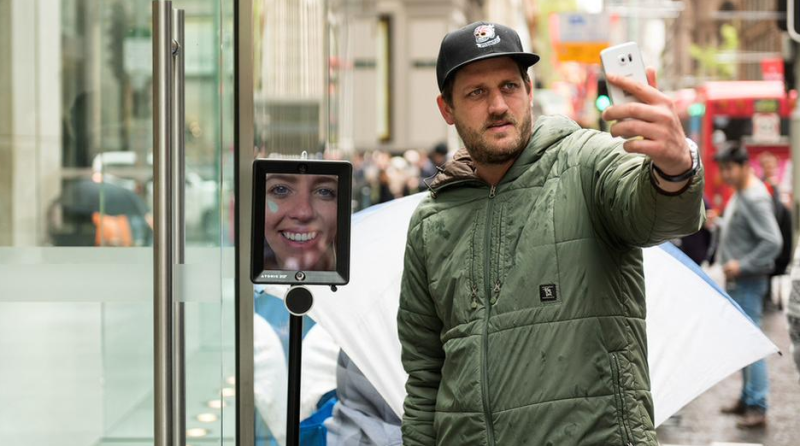 This buyer, a media exec in Australia, sent a robot proxy to wait in the line. (photo: Mashable)